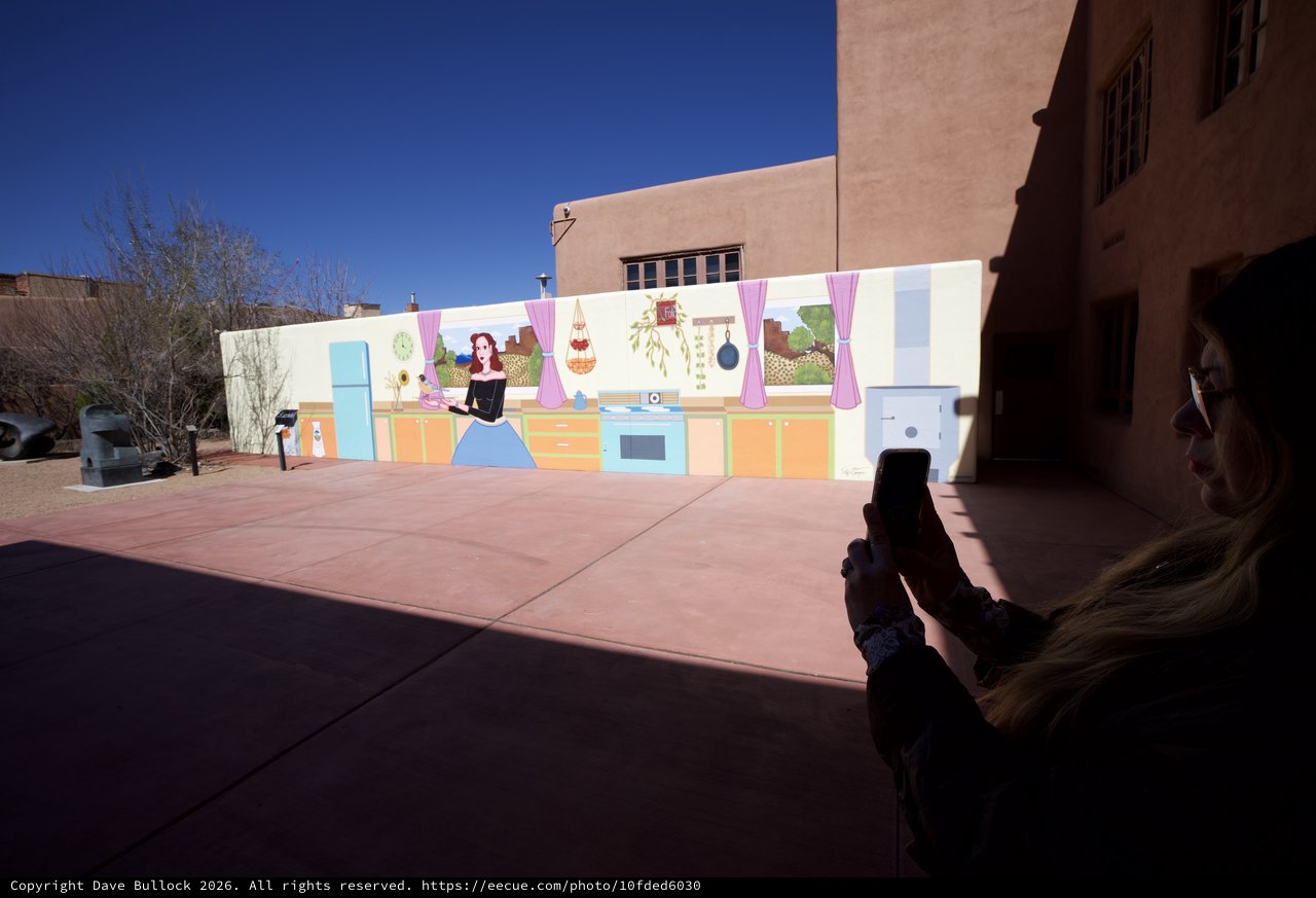 Woman Photographing Colorful Kitchen Mural in Santa Fe