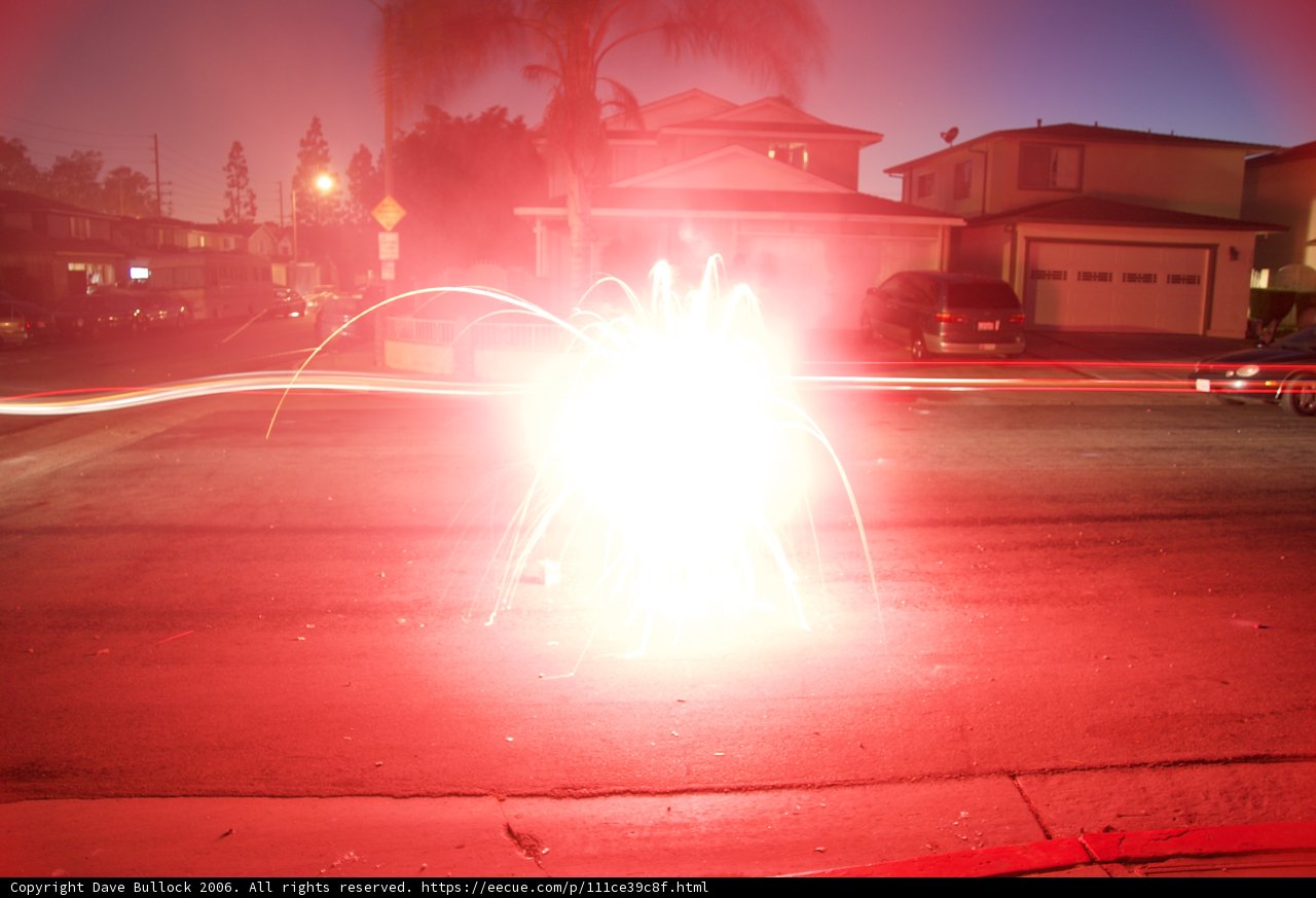 A Burst of Red Fireworks on the Street