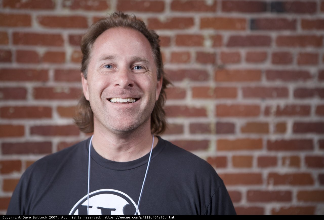 Smiling Man in Black T-Shirt