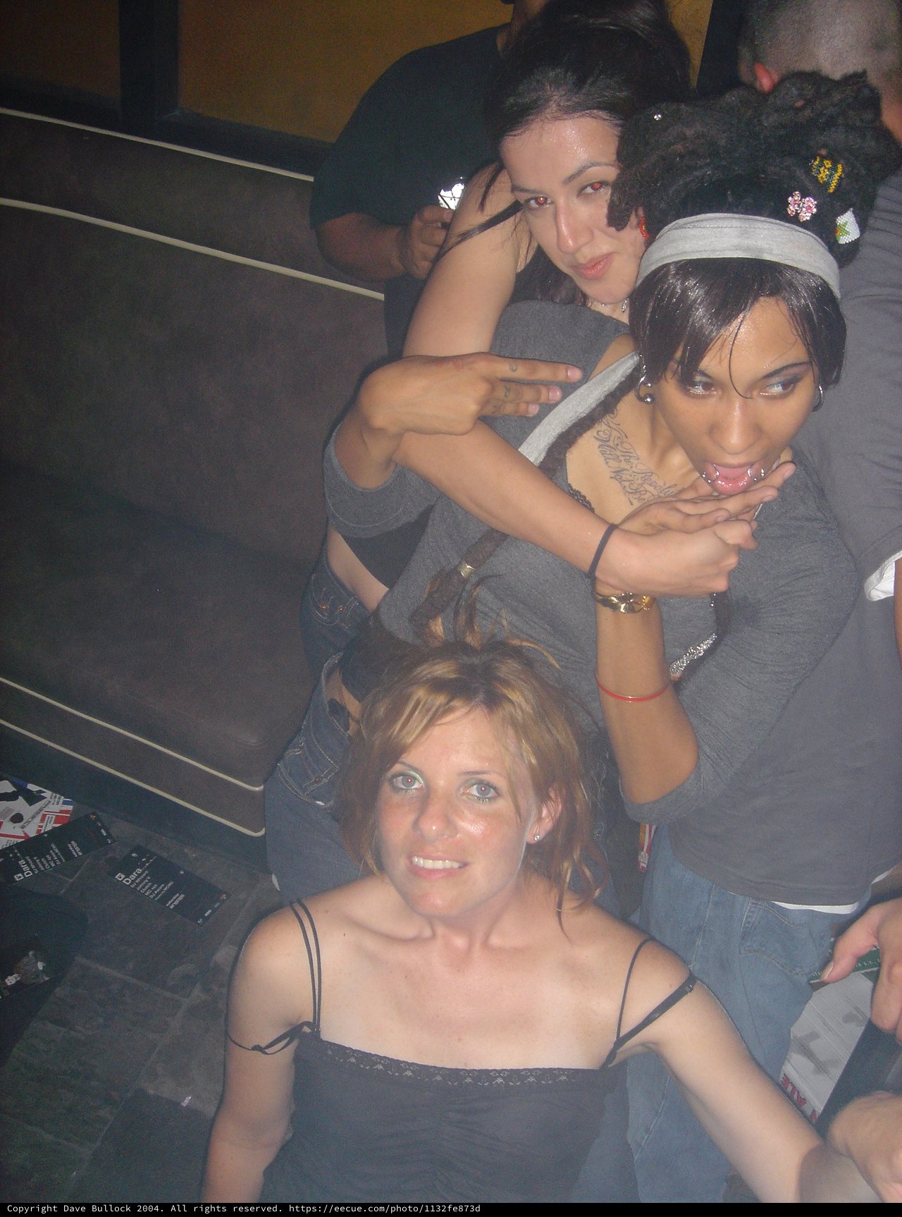 Three Women Posing at a Nightclub Party 2004