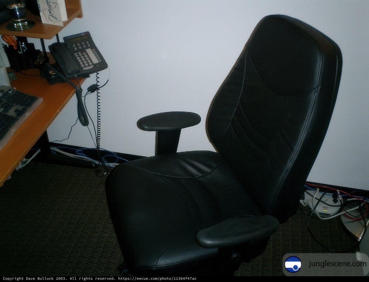 Black Office Chair with Phone and Computer