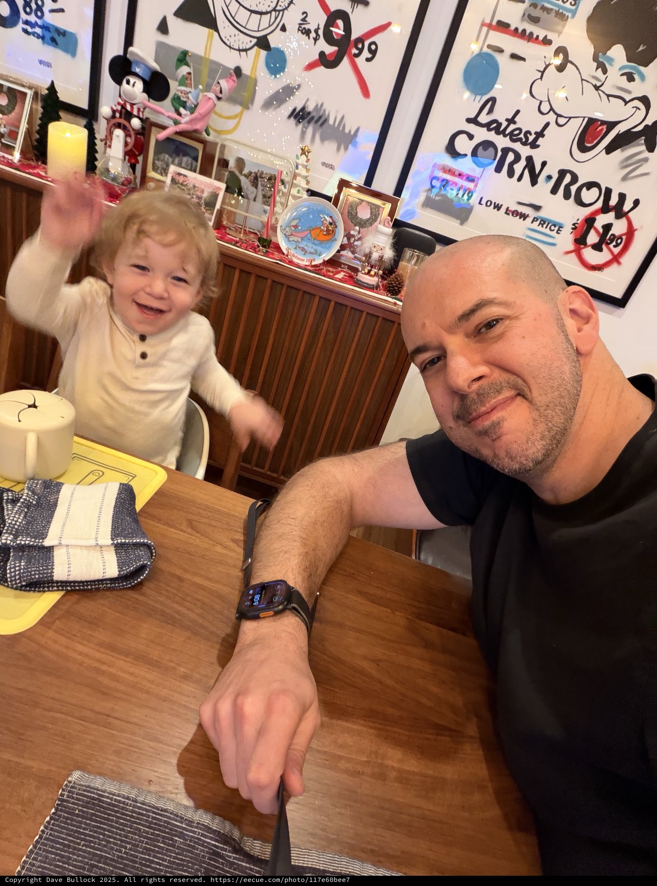Father and Toddler Sharing Joyful Breakfast Moment at Home