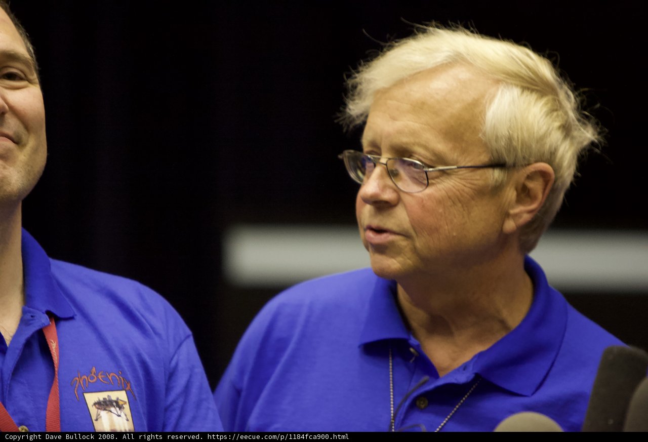 Two Men with Blue Shirts and Glasses