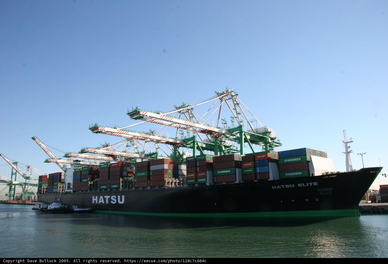 Massive Freighter Unloads Cargo at Busy Port