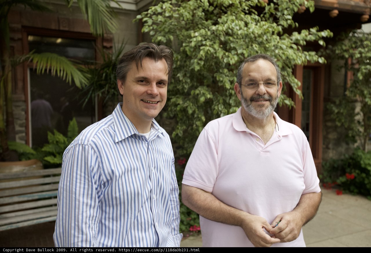 Two Men Standing in front of a Beautiful Building