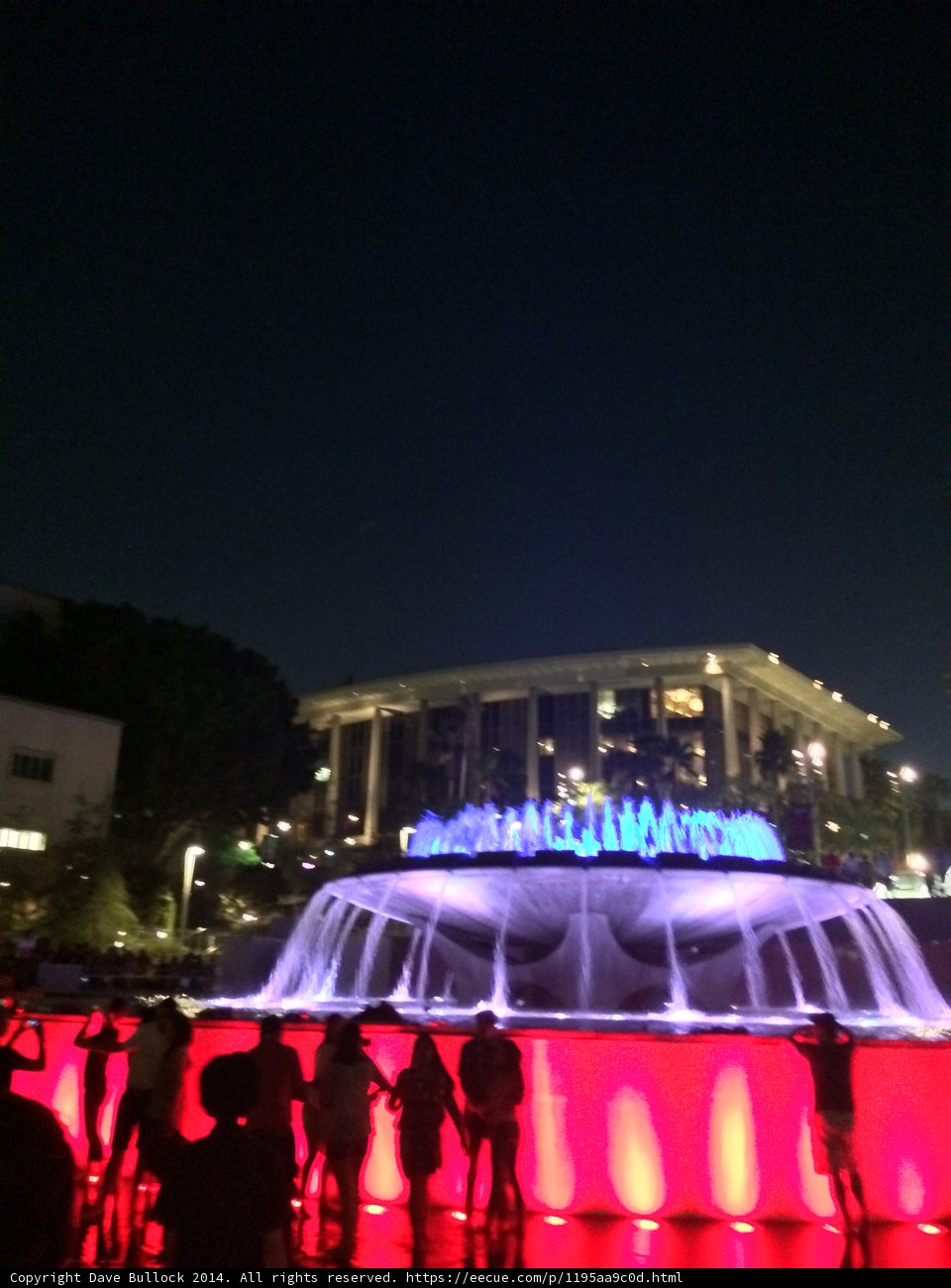 Nighttime Gathering Around Civic Center Mall's Fountain