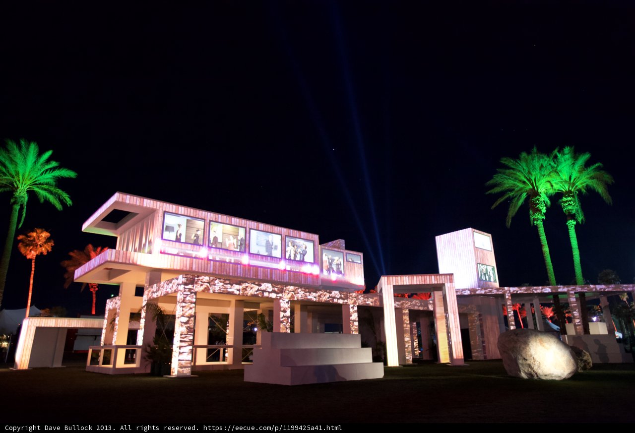 White Facade and Palm Trees at Night