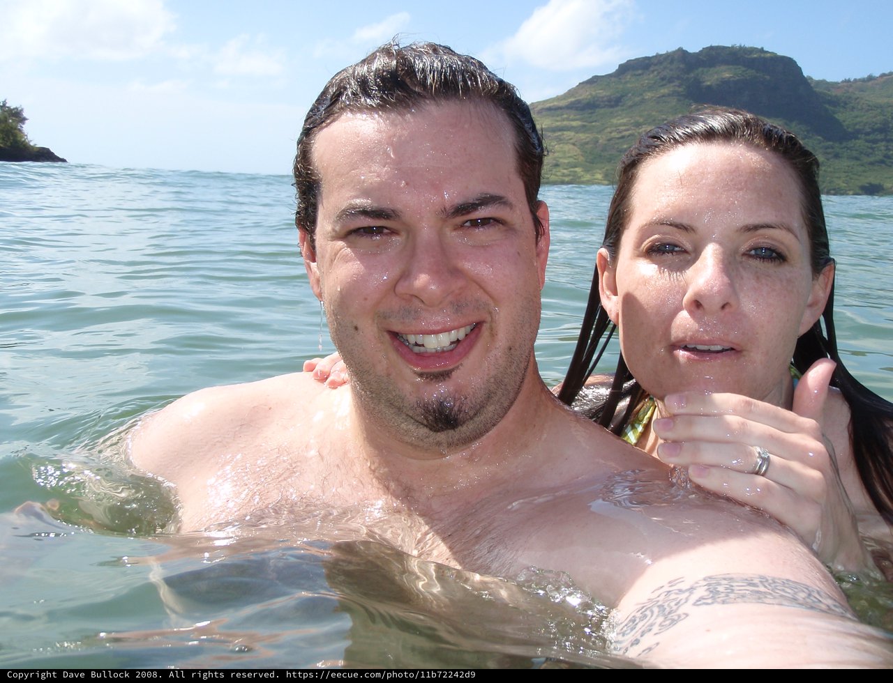 Couple Swimming in Hawaiian Ocean Waters Together