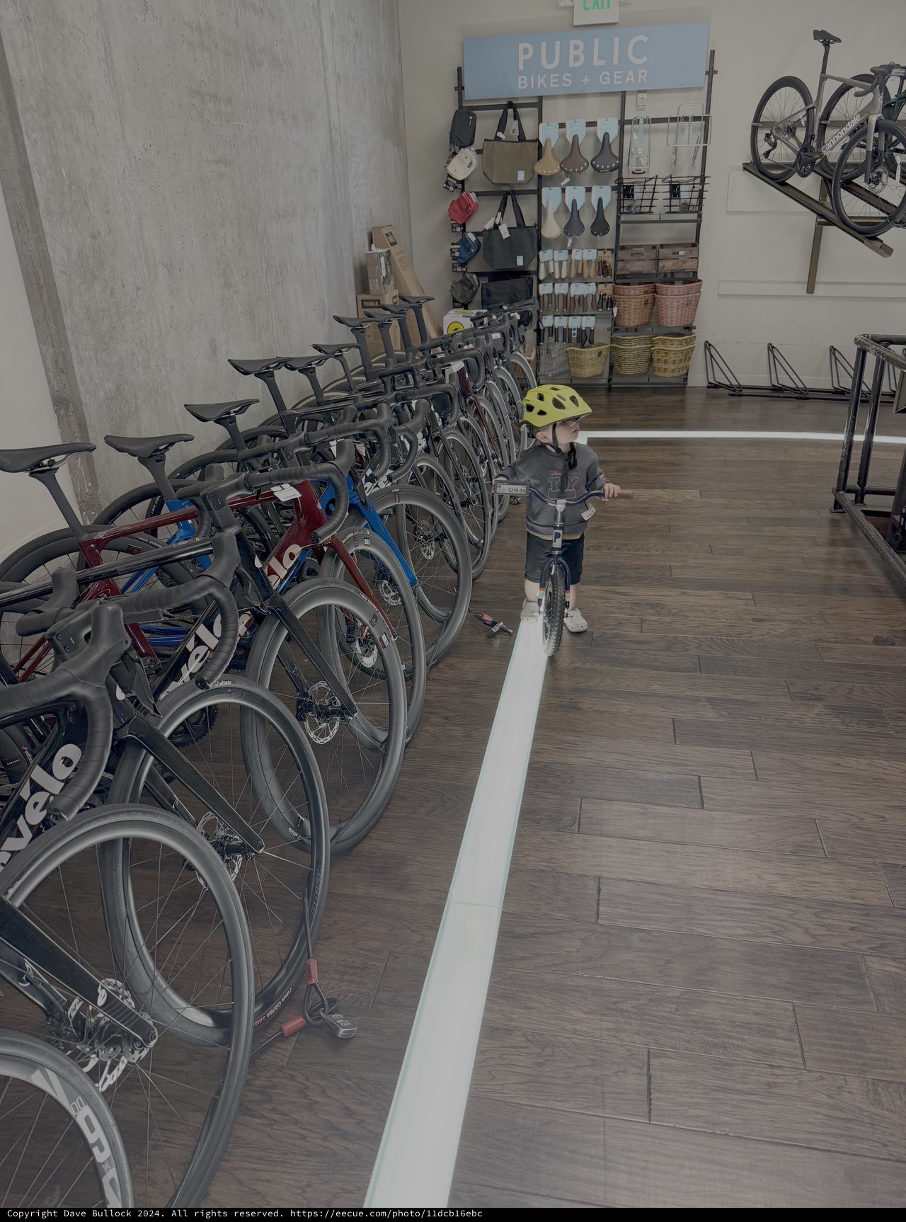 Child Explores Public Bikes + Gear Shop