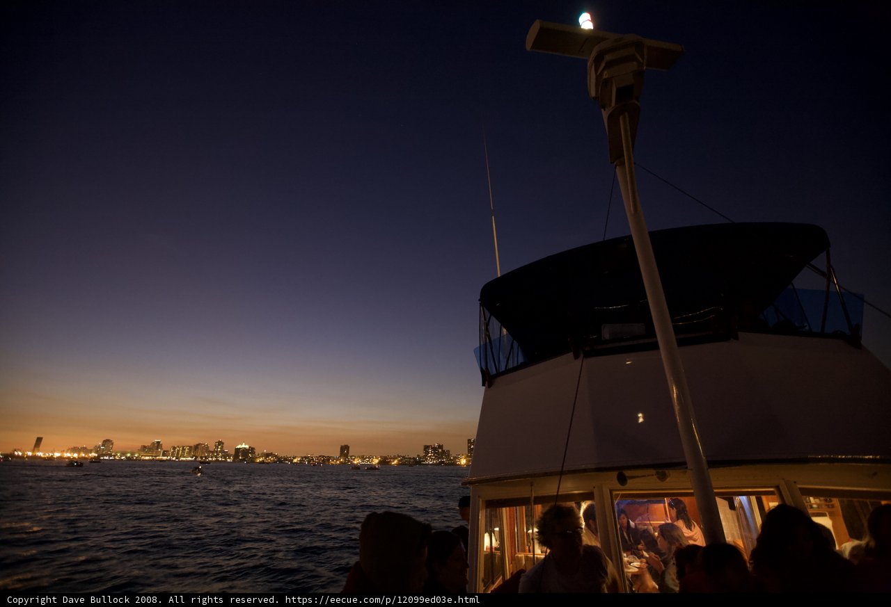 Nighttime Boat Ride with Cityscape