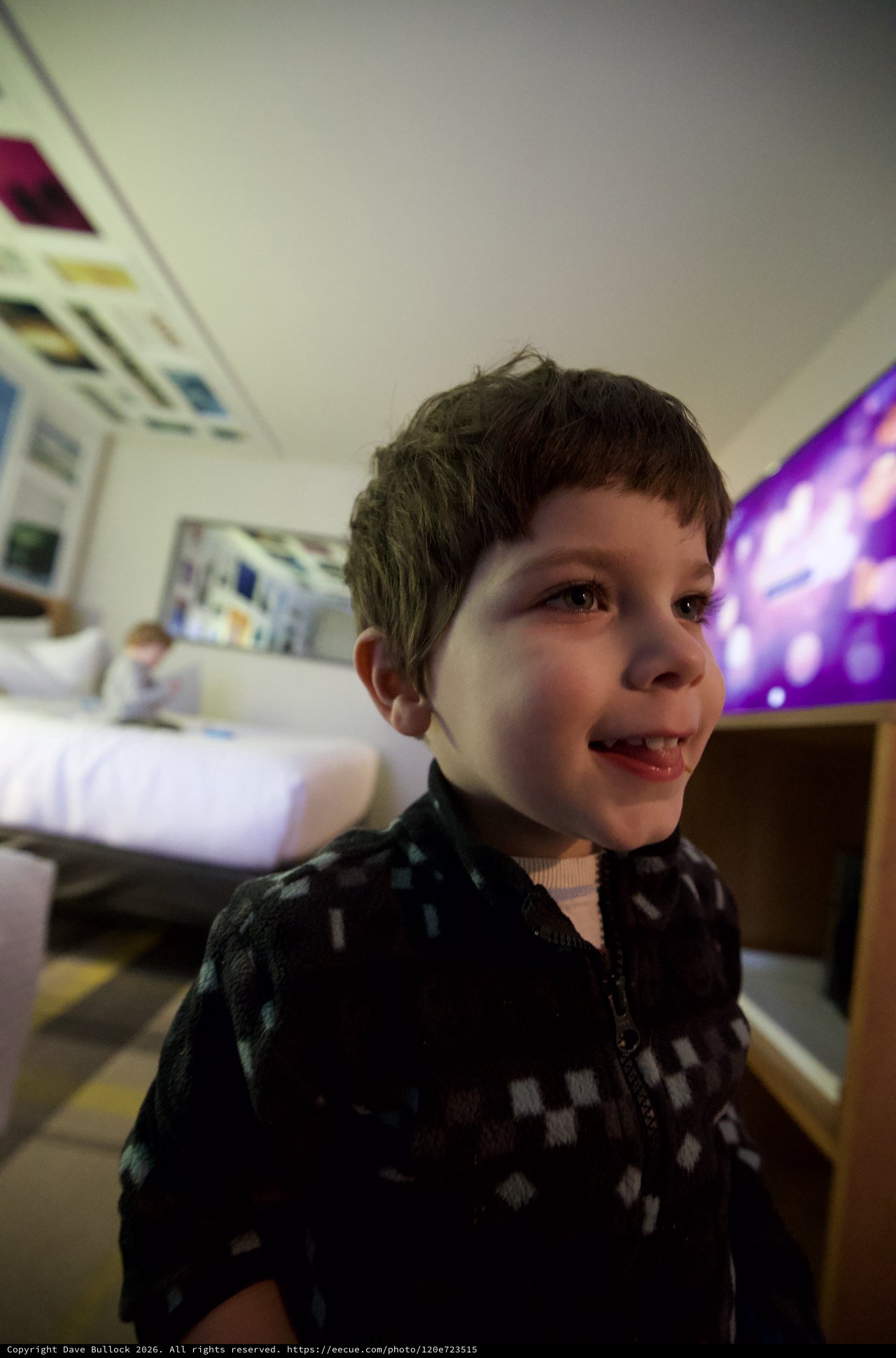 Young Boy's Joyful Evening Portrait at Home