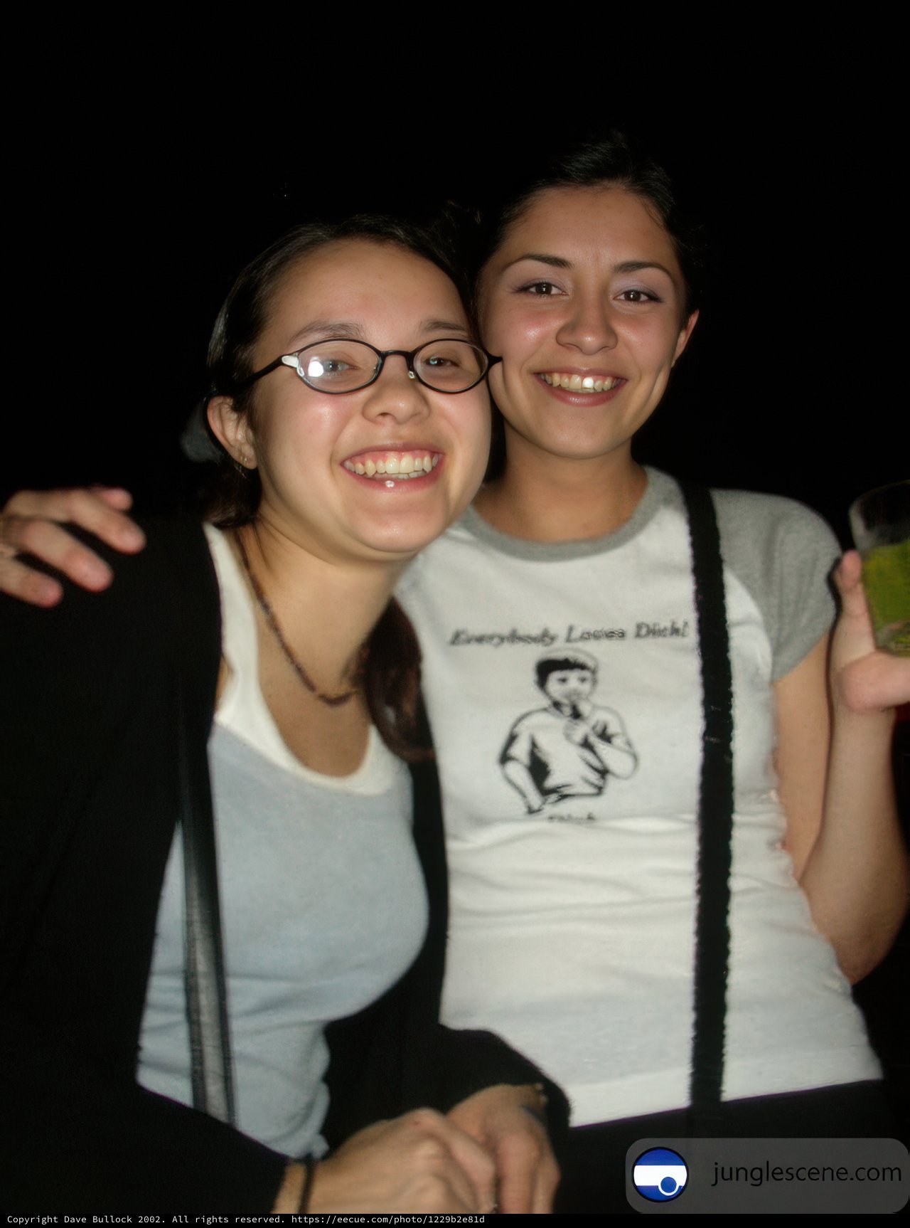 Two Women in Glasses Pose for a Portrait
