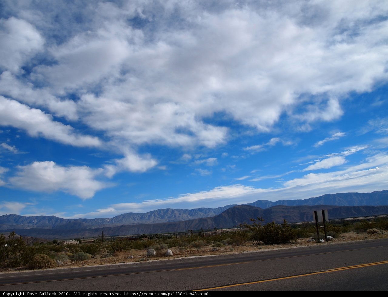 Majestic Mountains and Clouds on the Highway