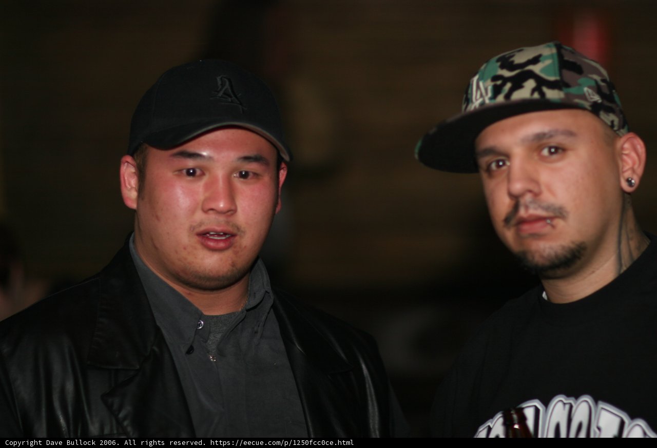 Two Men in Jackets and Baseball Caps
