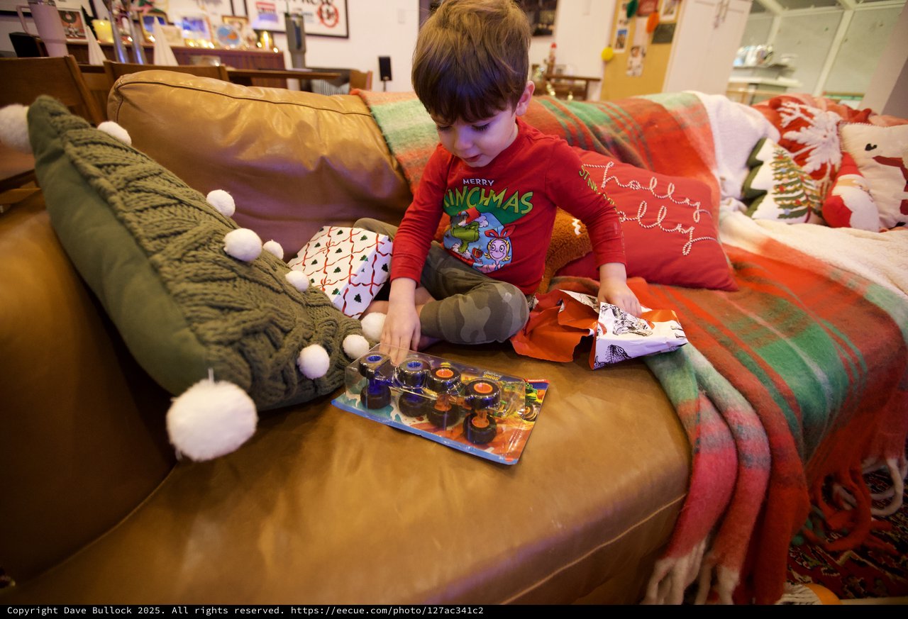 Child Opening Toy on Christmas Morning