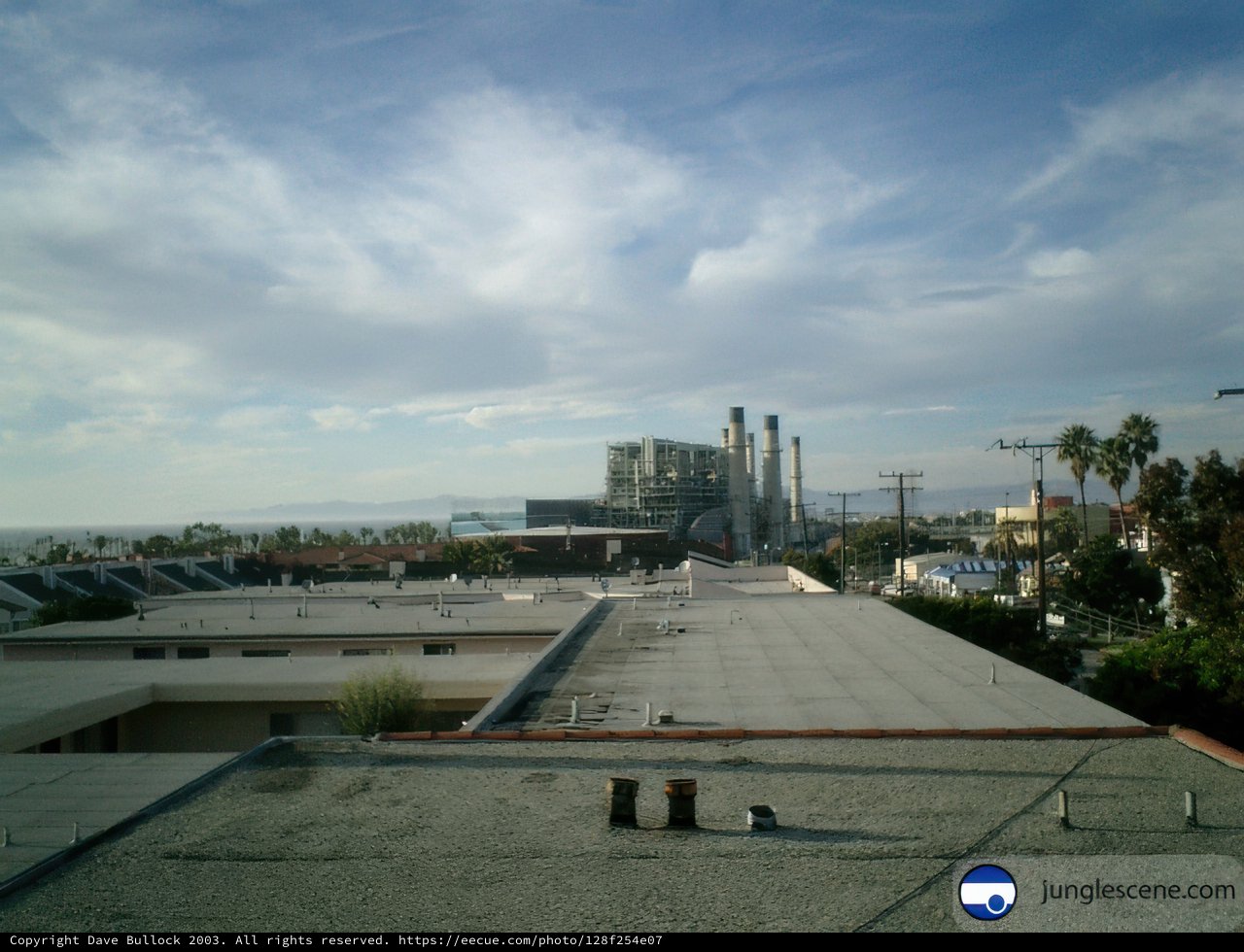 Rooftop View of Urban Metropolis and Factory by the Ocean