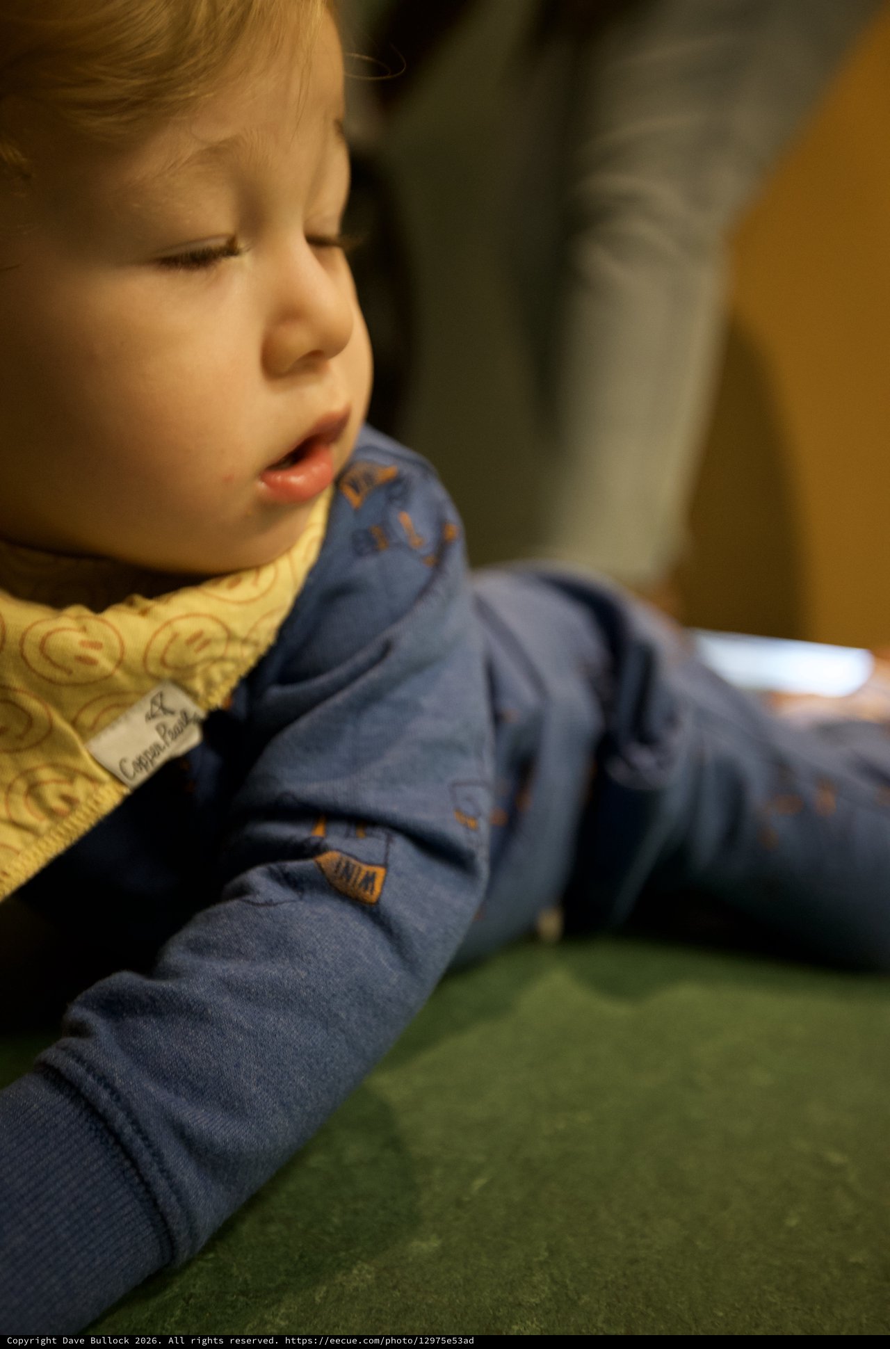 Young Child in Quiet Contemplation at Indoor Setting