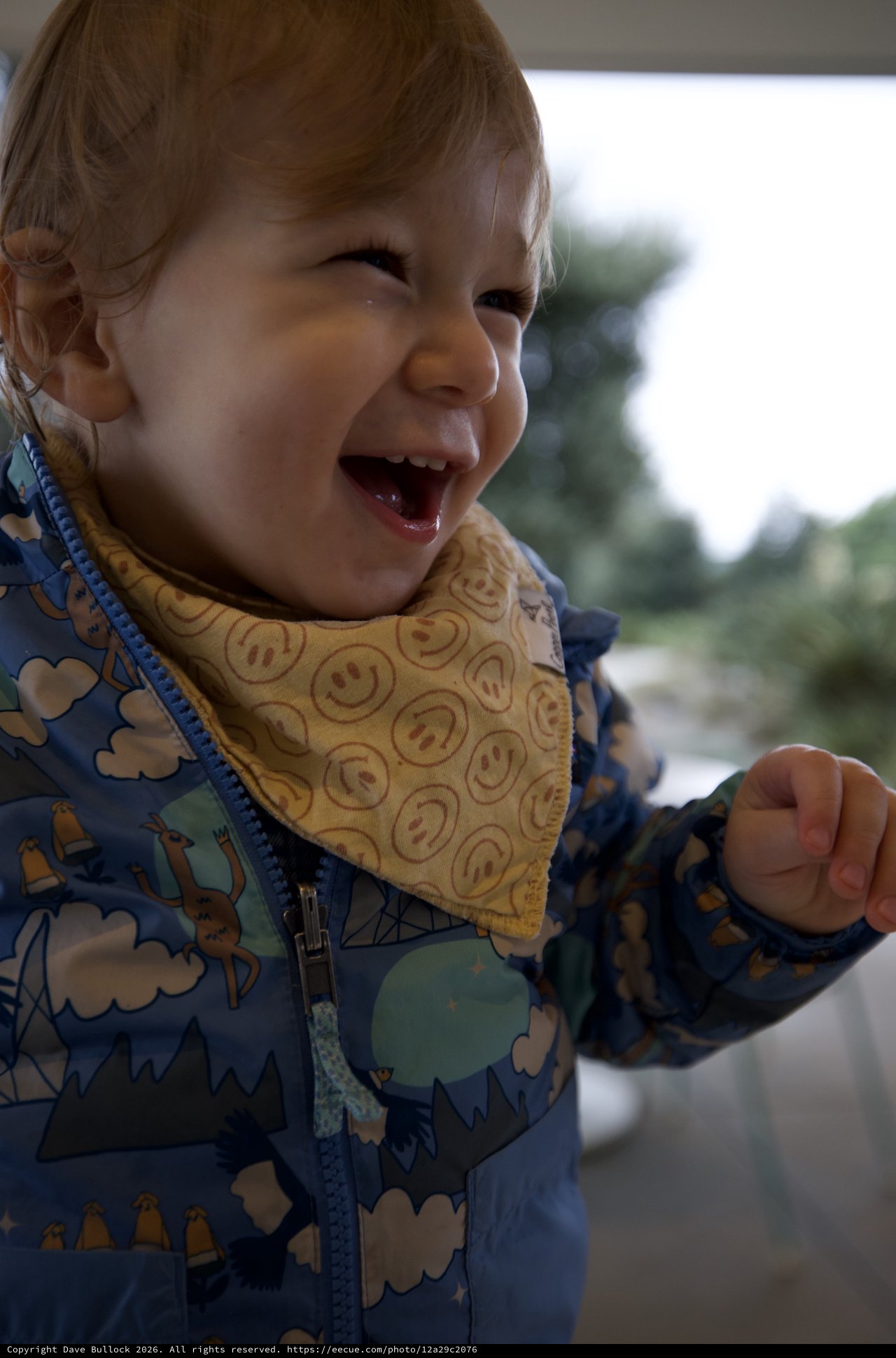 Joyful Toddler in Winter Jacket Outdoors