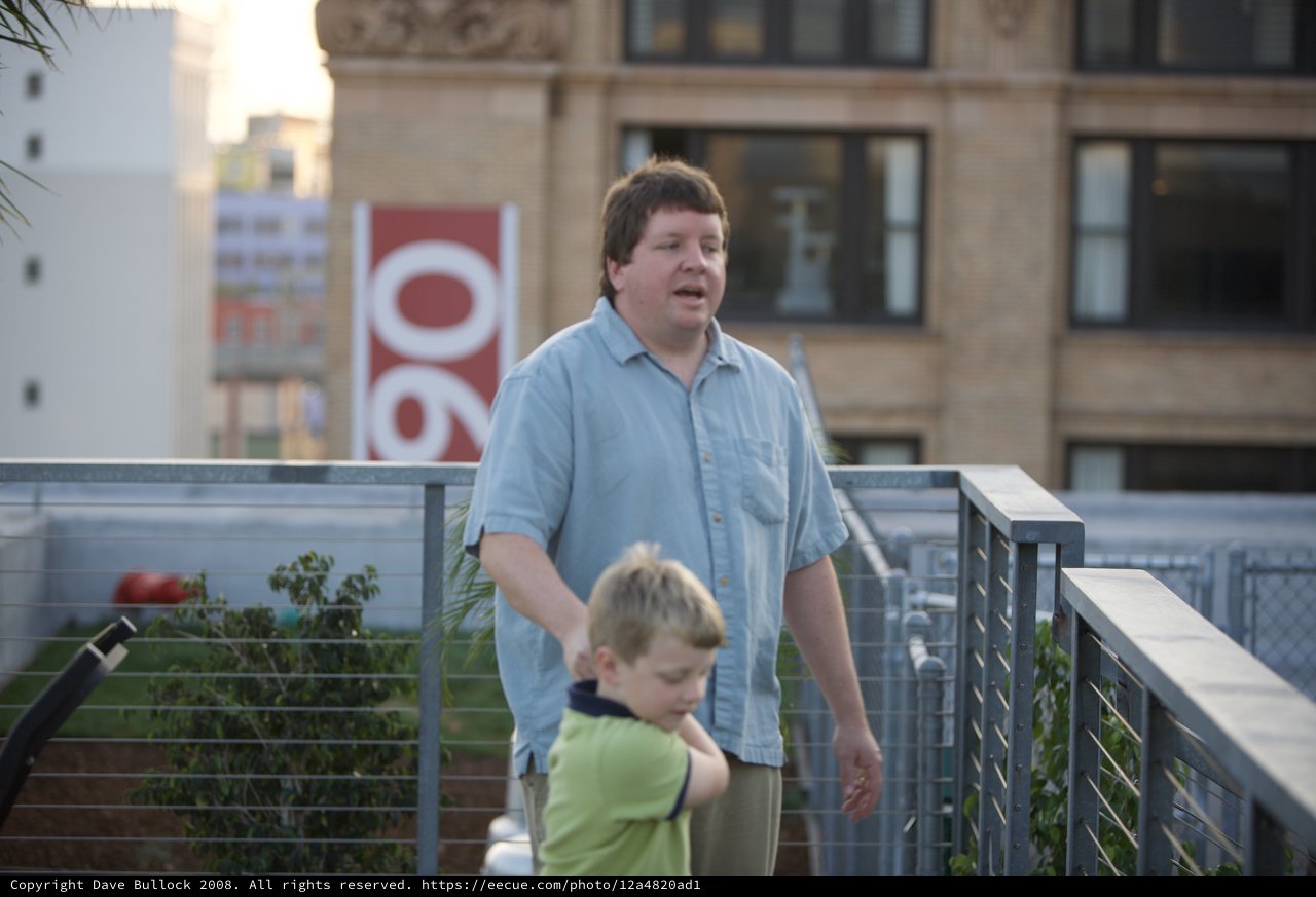 Father and Son on Urban Rooftop Terrace