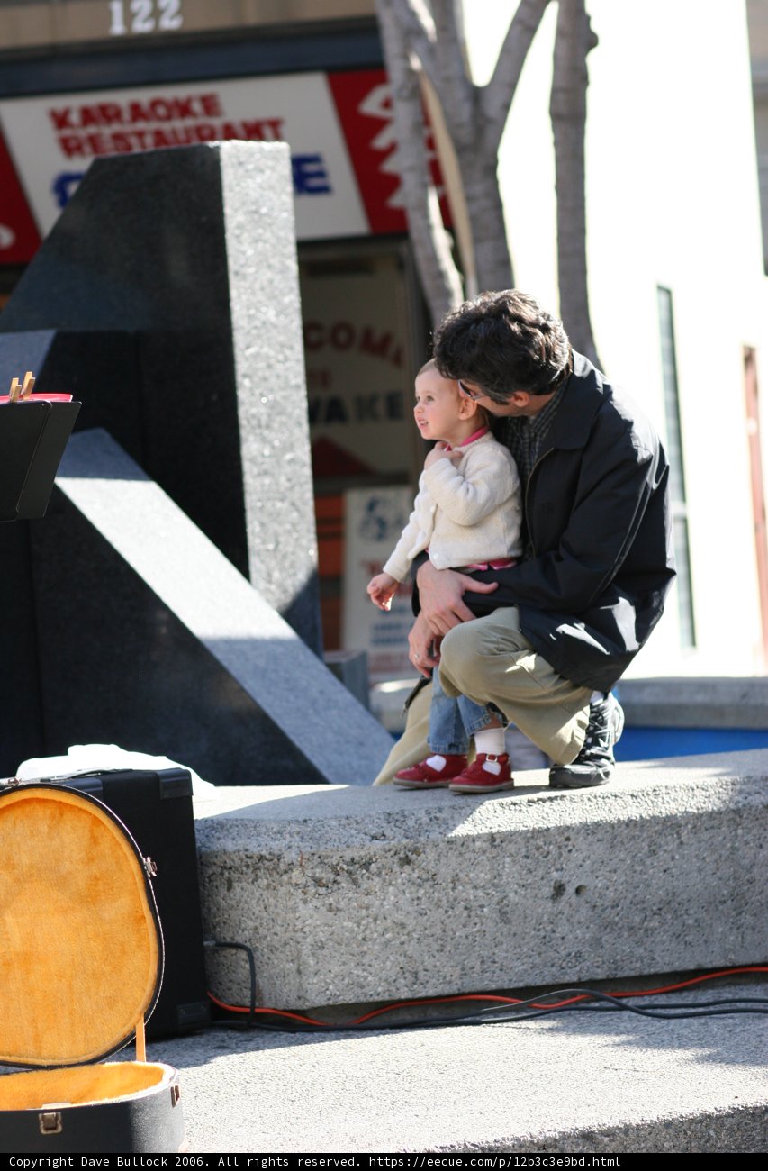 Father and Son Bonding on a Concrete Ledge
