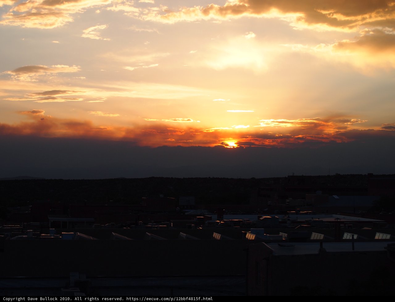 City Sunset with Clouds and Sun