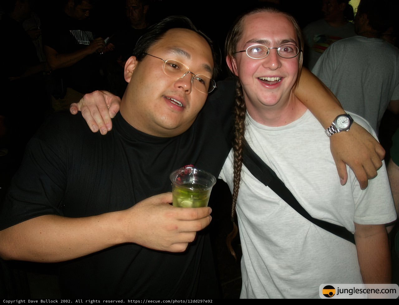 Party Snapshot: Two Men Cheersing