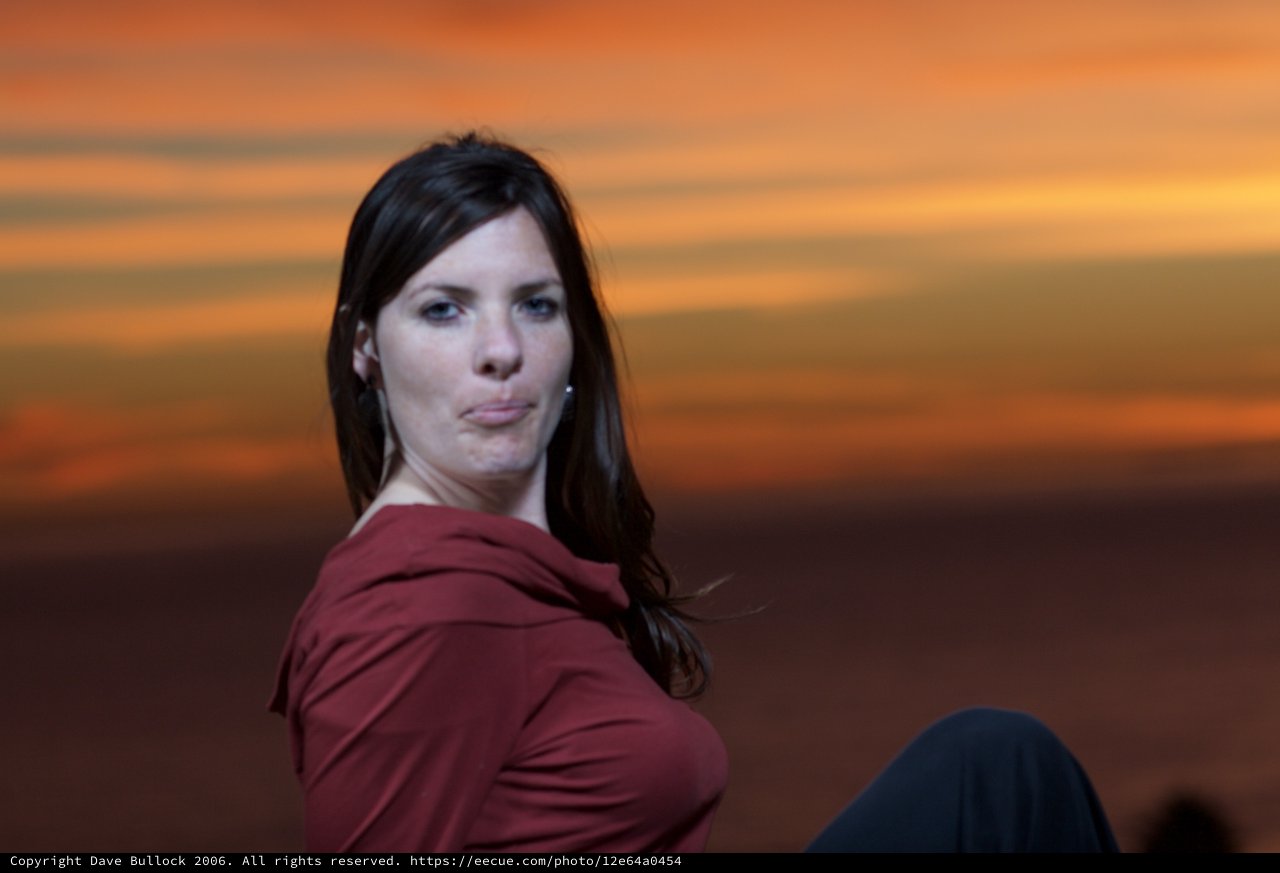 Woman in Red at a Dramatic Sunset Sky