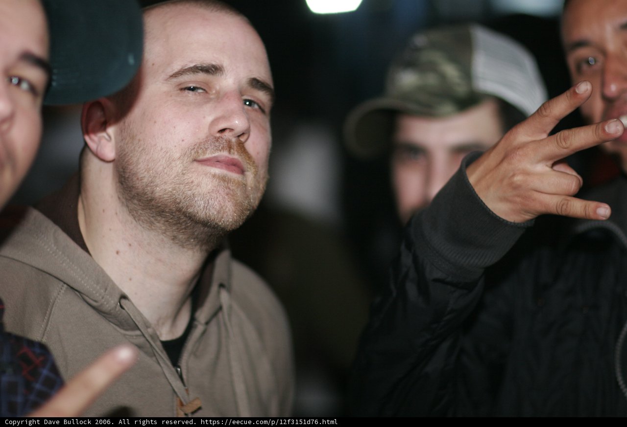 Black-Jacketed Man with Friends