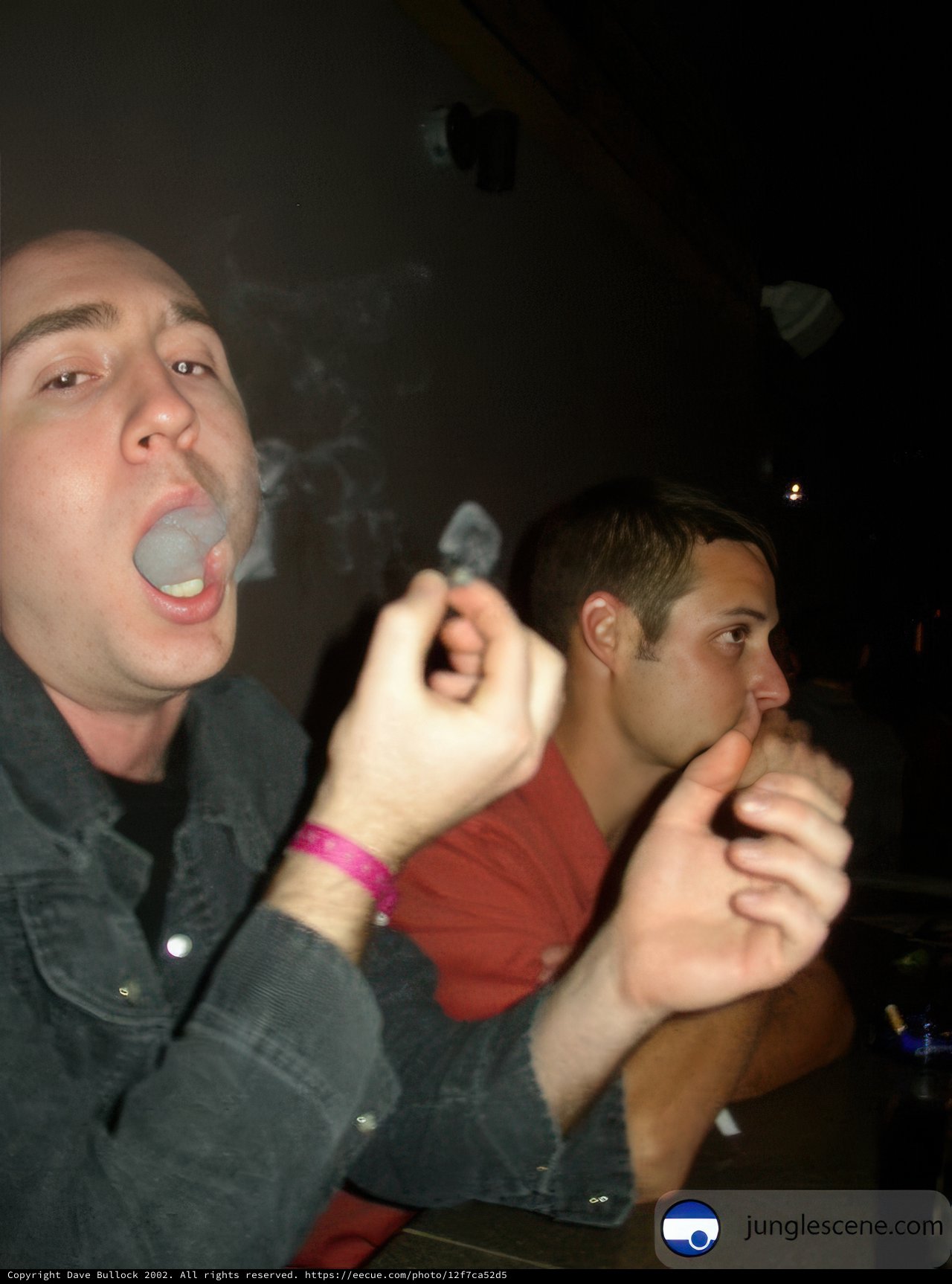 Two Men Enjoying a Smoke Break