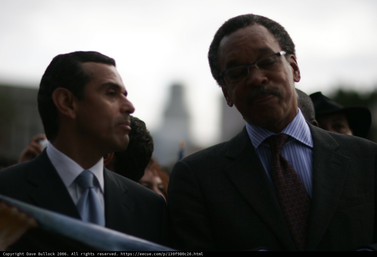 Two Men in Suits Standing Together