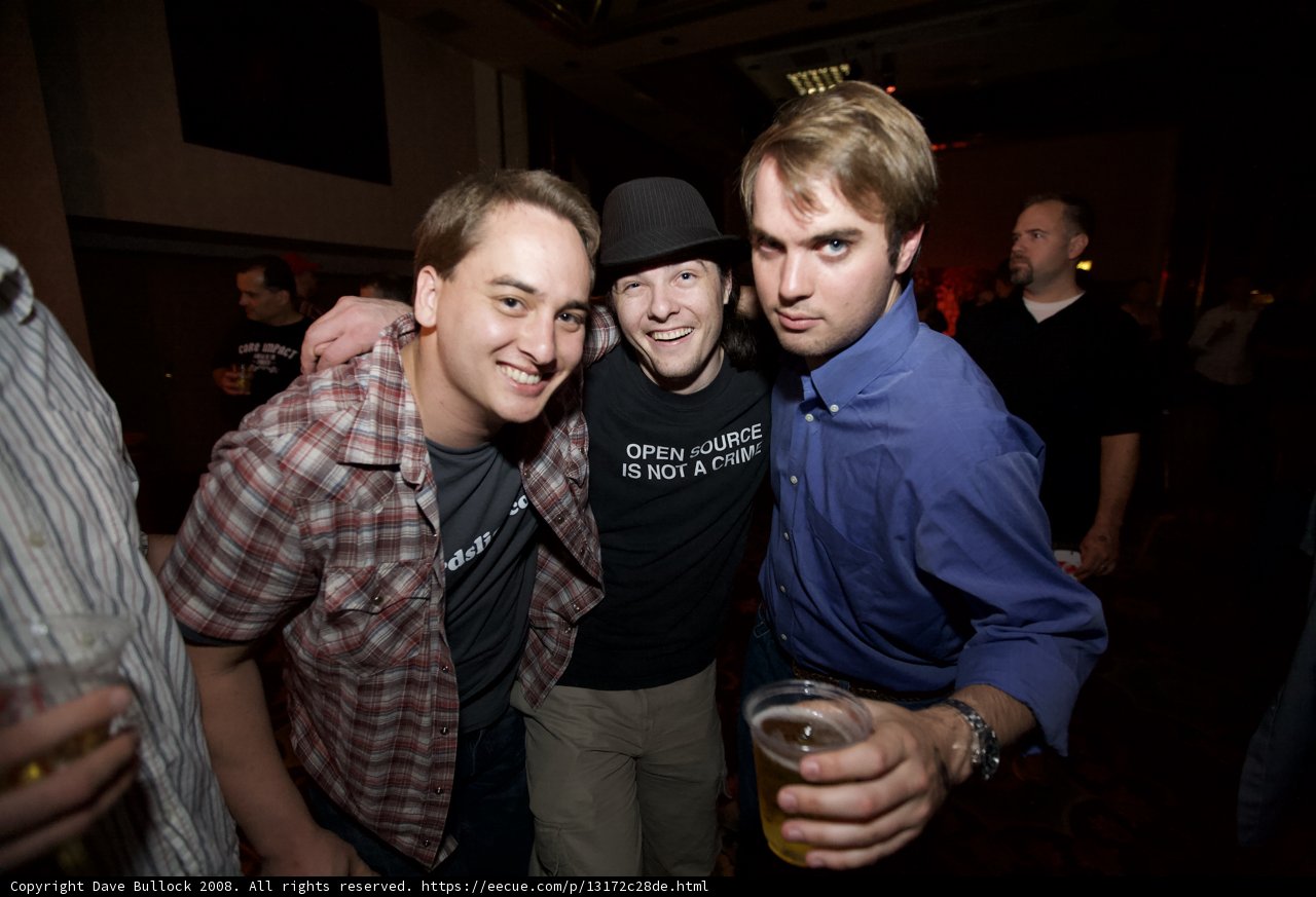 Three Men Raise a Glass at Urban Pub