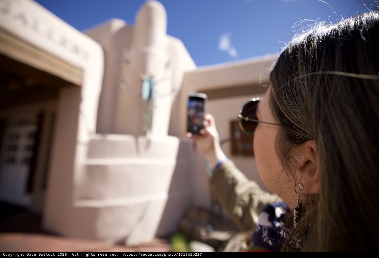 Tourist Photographing Adobe Architecture in Santa Fe
