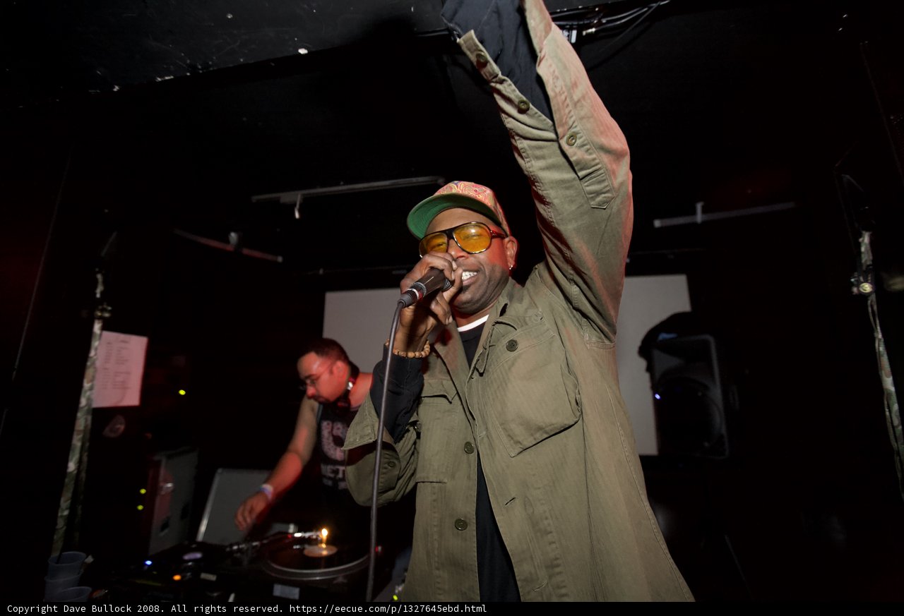 Green Jacketed Entertainer With Microphone