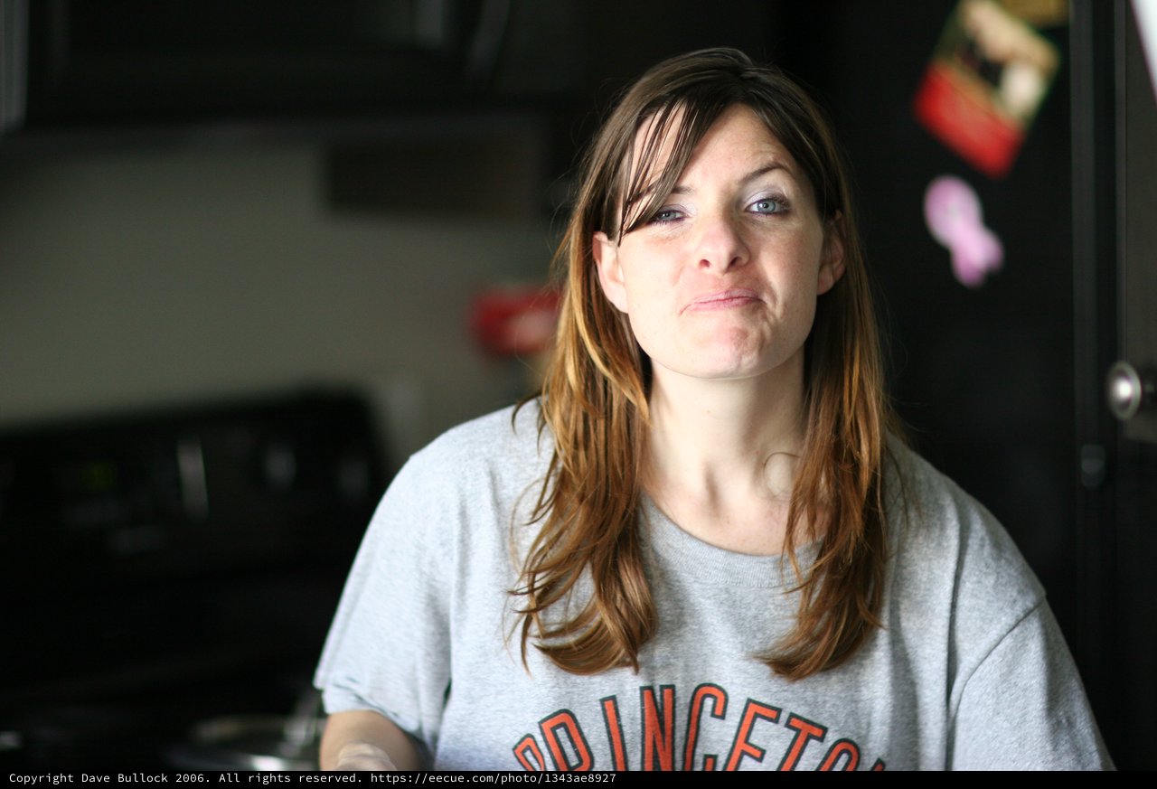 Candid Kitchen Portrait of a Thoughtful Woman