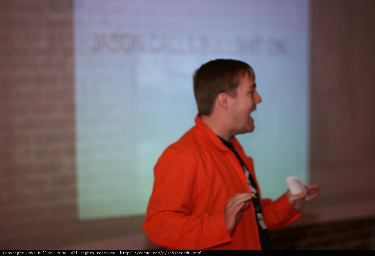 The Speaker in Orange