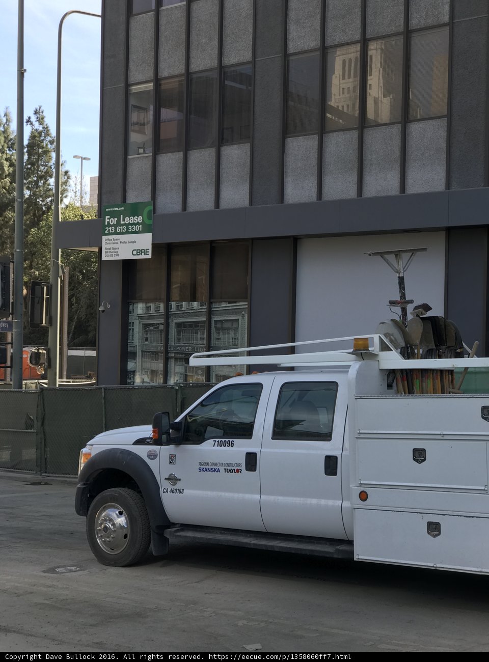 White Pickup Truck Parked in Front of Building