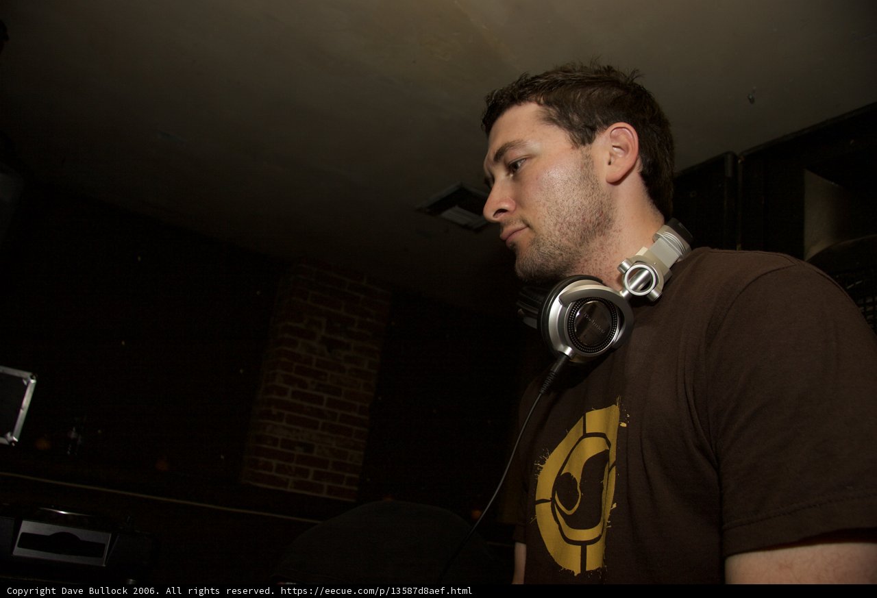 Musician in Brown Shirt and Headphones