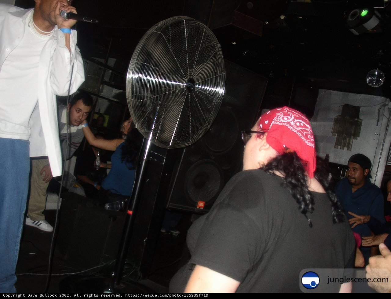 Nightclub performer with a red bandana