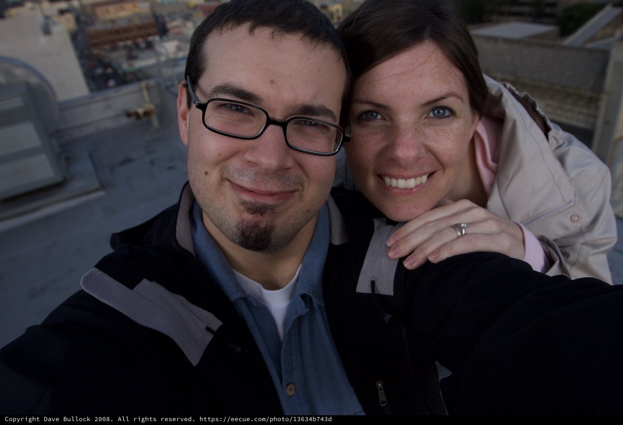 Rooftop Couple Selfie with City Views Below