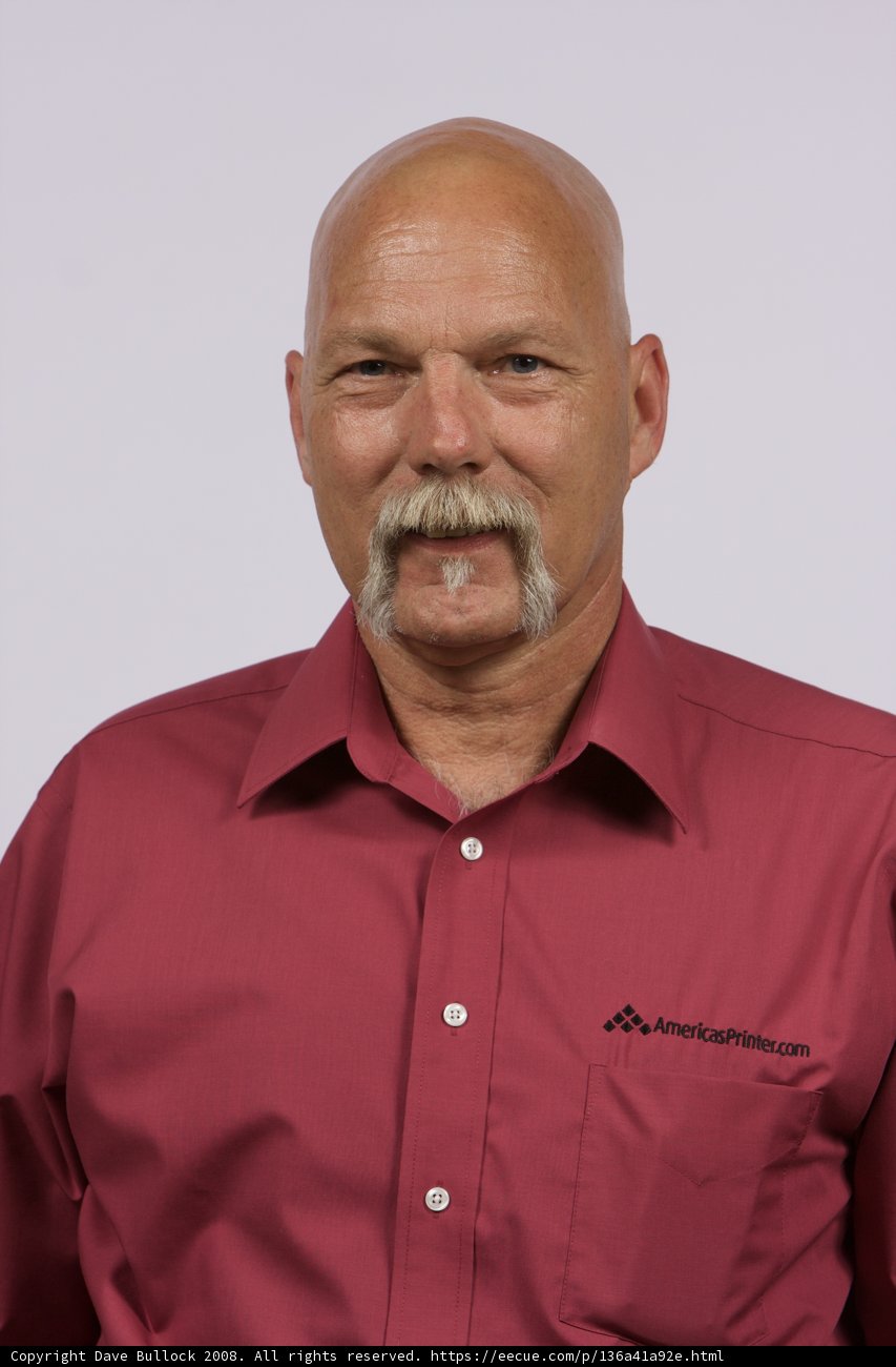 Red-Shirted Bald Man with a Mustache