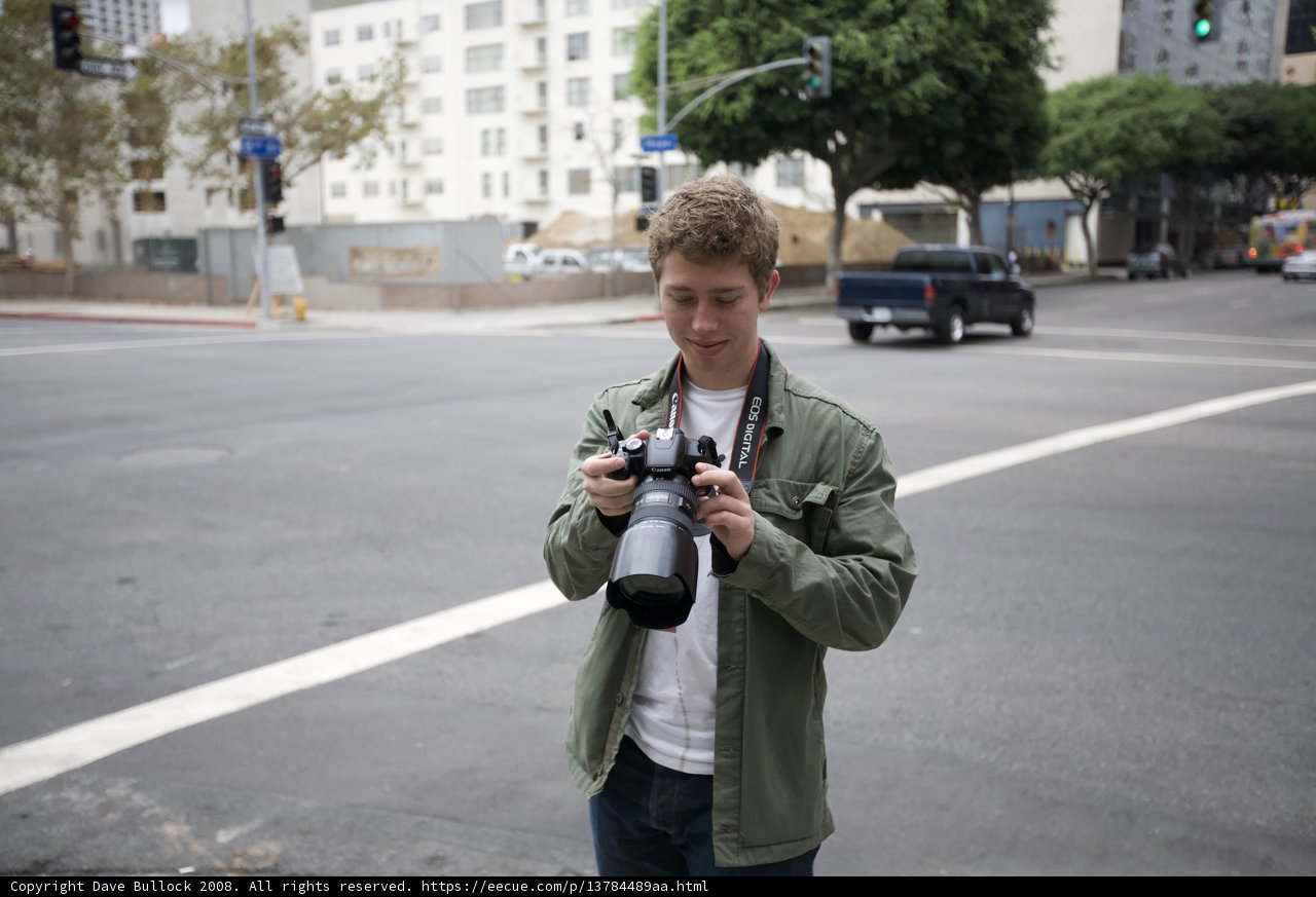 Young Photographer Captures Pickup Truck on Busy City Street