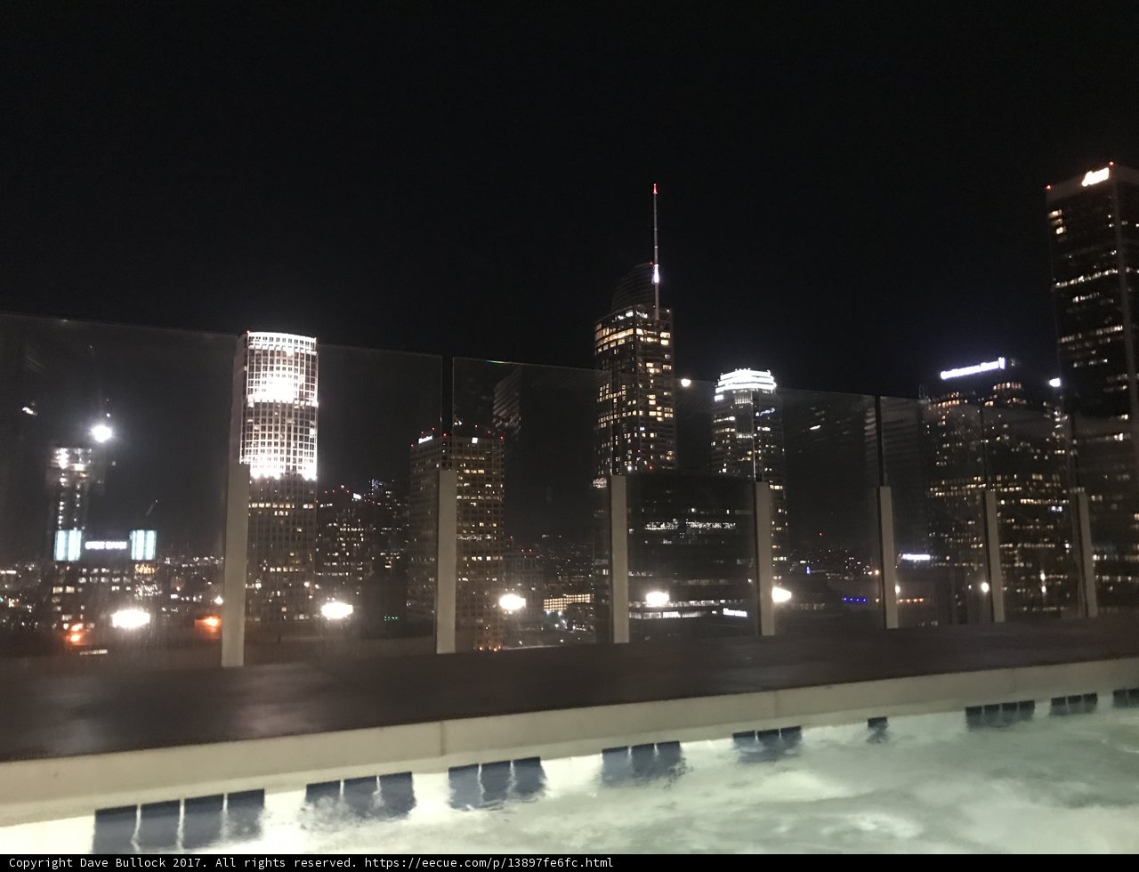 City Skyline at Night from Rooftop Pool