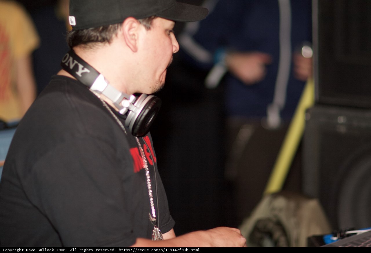 Black-Shirted Man with Baseball Cap and Headphones