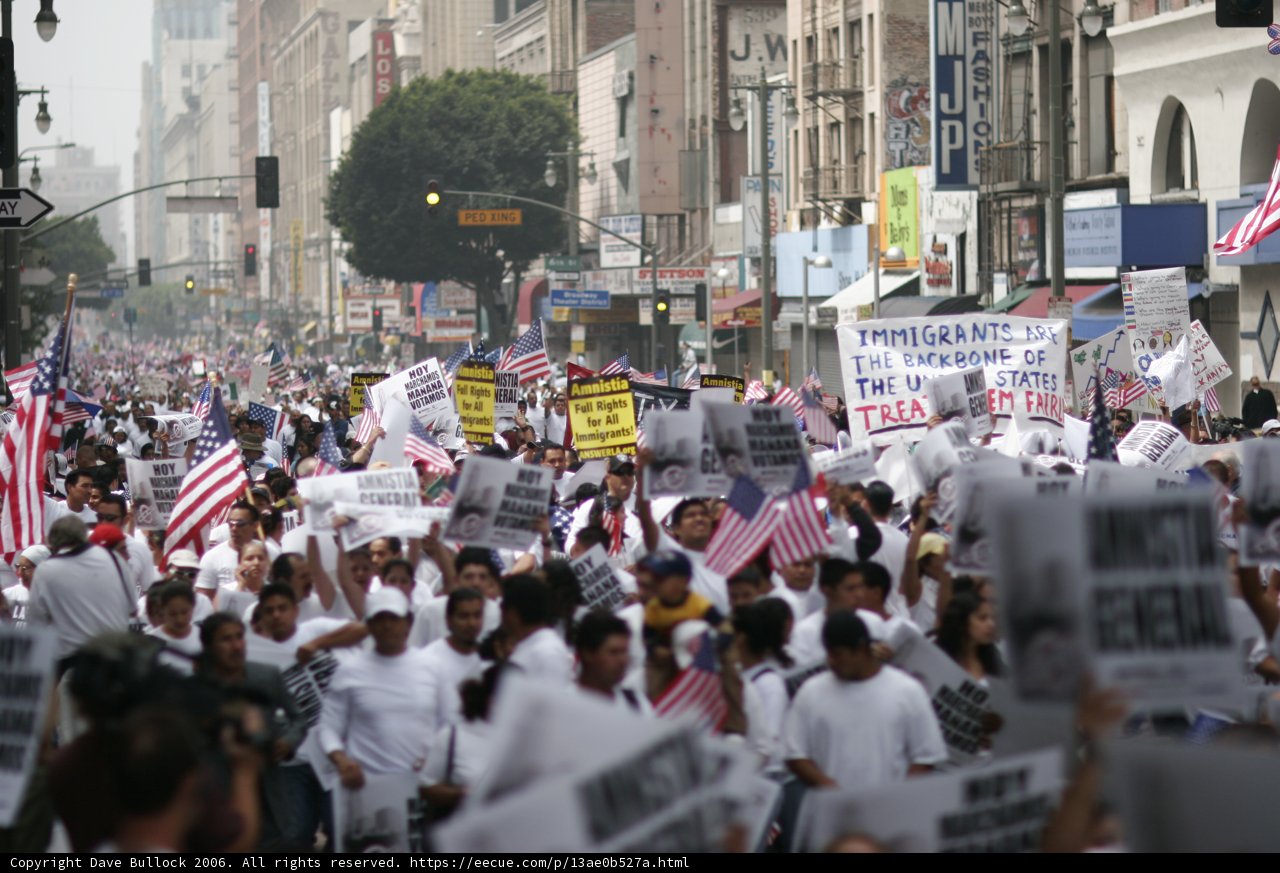 Protesters march through urban metropolis