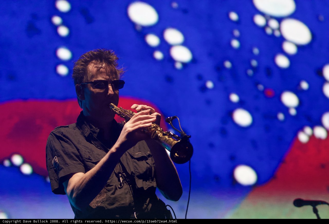 Saxophonist Serenades Spectators on Colorful Stage