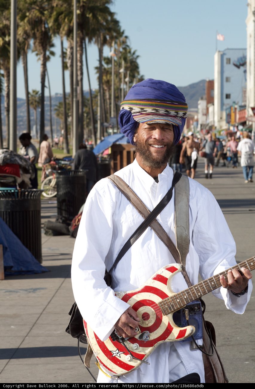 Turban-wearing musician enjoying the sunny day