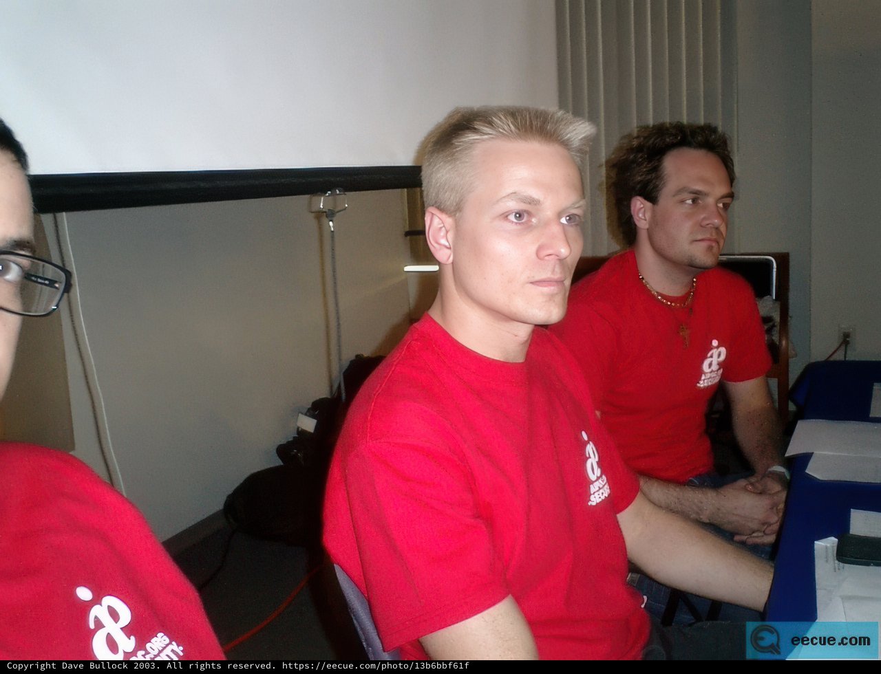 Three Men Gathering with Their Gadgets
