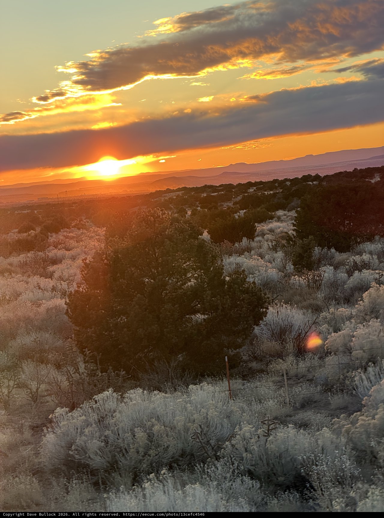 Desert Sunset Over Sagebrush and Distant Mountains