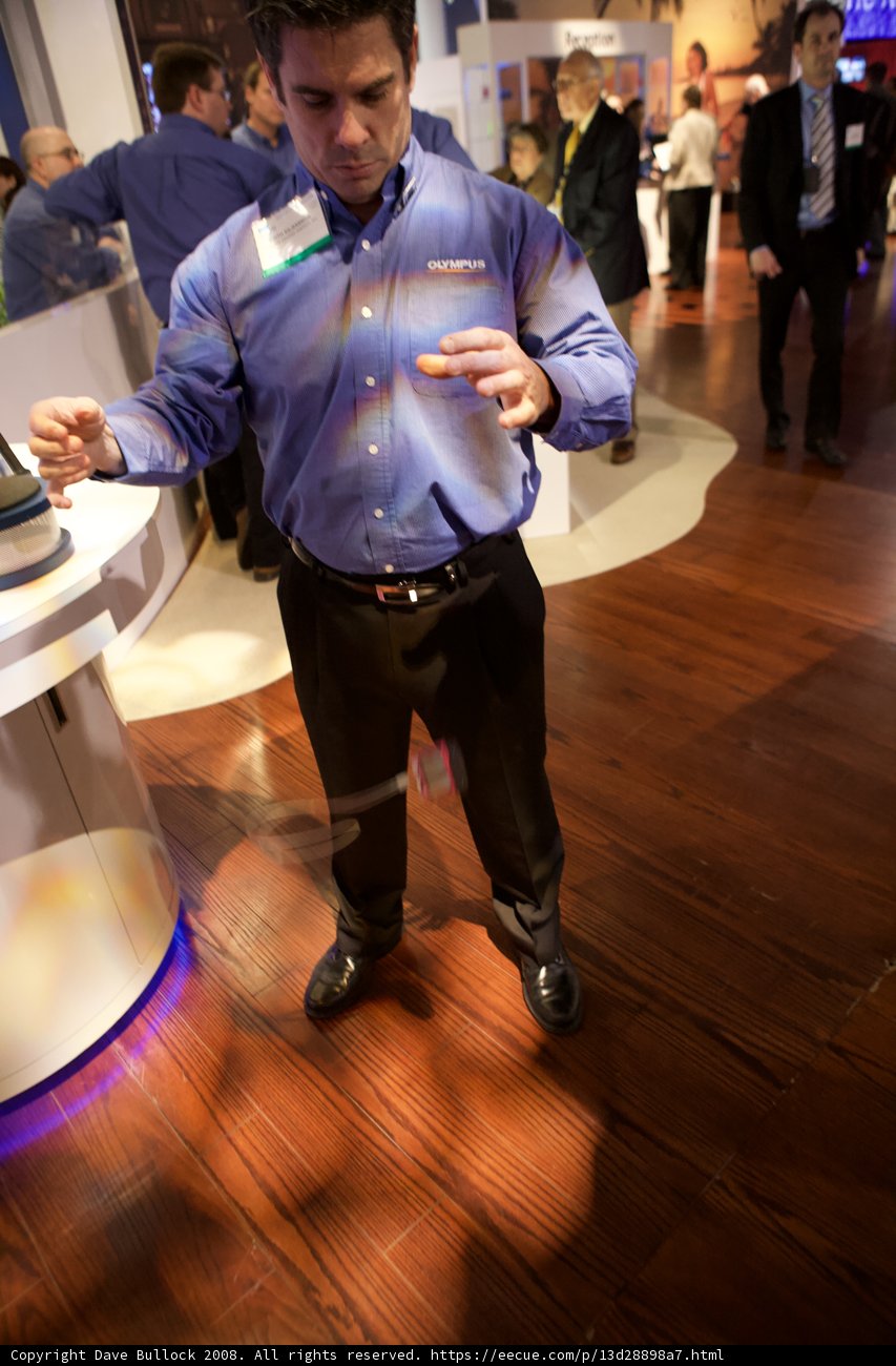 Sergei Ryabov in Blue Shirt on Hardwood Flooring