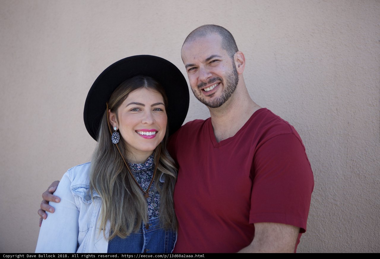 Smiling Couple in Matching Cowboy Hats